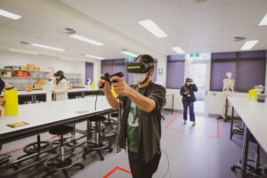 Participants wear VR headsets in the anatomy labs.