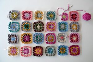 A series of crochet flowers in different colours.